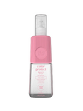 Pink and clear bottle of color protect hair spray on a white background