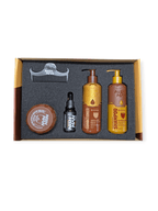 Set of hair care products including shampoo, conditioner, and a comb in a box on a white background