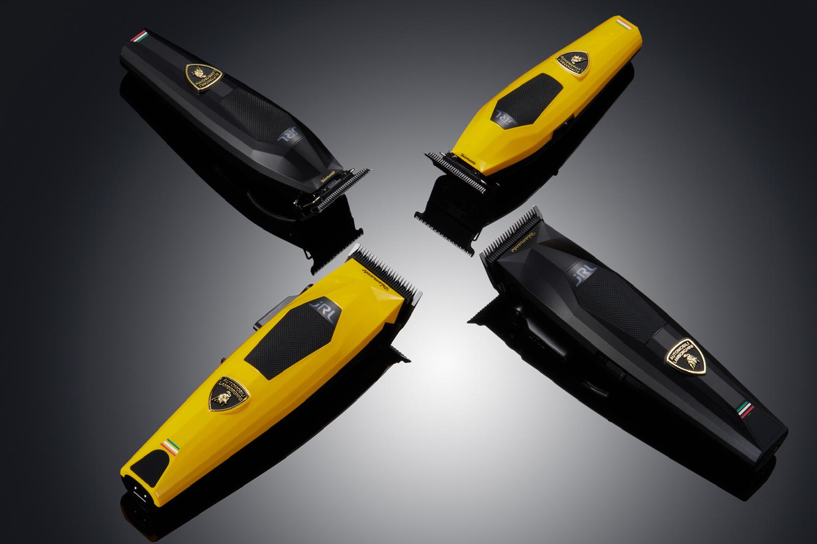 Four hair trimmers in black and yellow on a reflective surface with a dark background