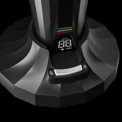 Close-up of a black electronic device with a digital display on a black background