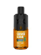 Bottle of Nish Man Shower Scrub with black cap on a black background